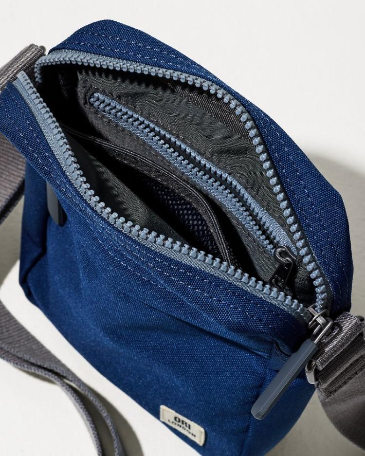 Men/Beach &amp; Home Luggage &amp; Travel | Tommy Bahama Bond Deep Blue Canvas Crossbody Deep Blue