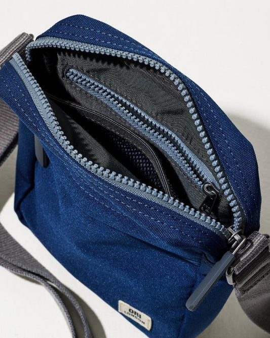 Men/Beach &amp; Home Luggage &amp; Travel | Tommy Bahama Bond Deep Blue Canvas Crossbody Deep Blue